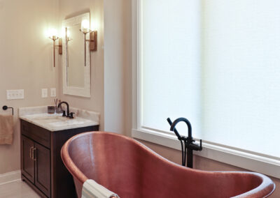 Copper bathtub in beautifully designed bathroom